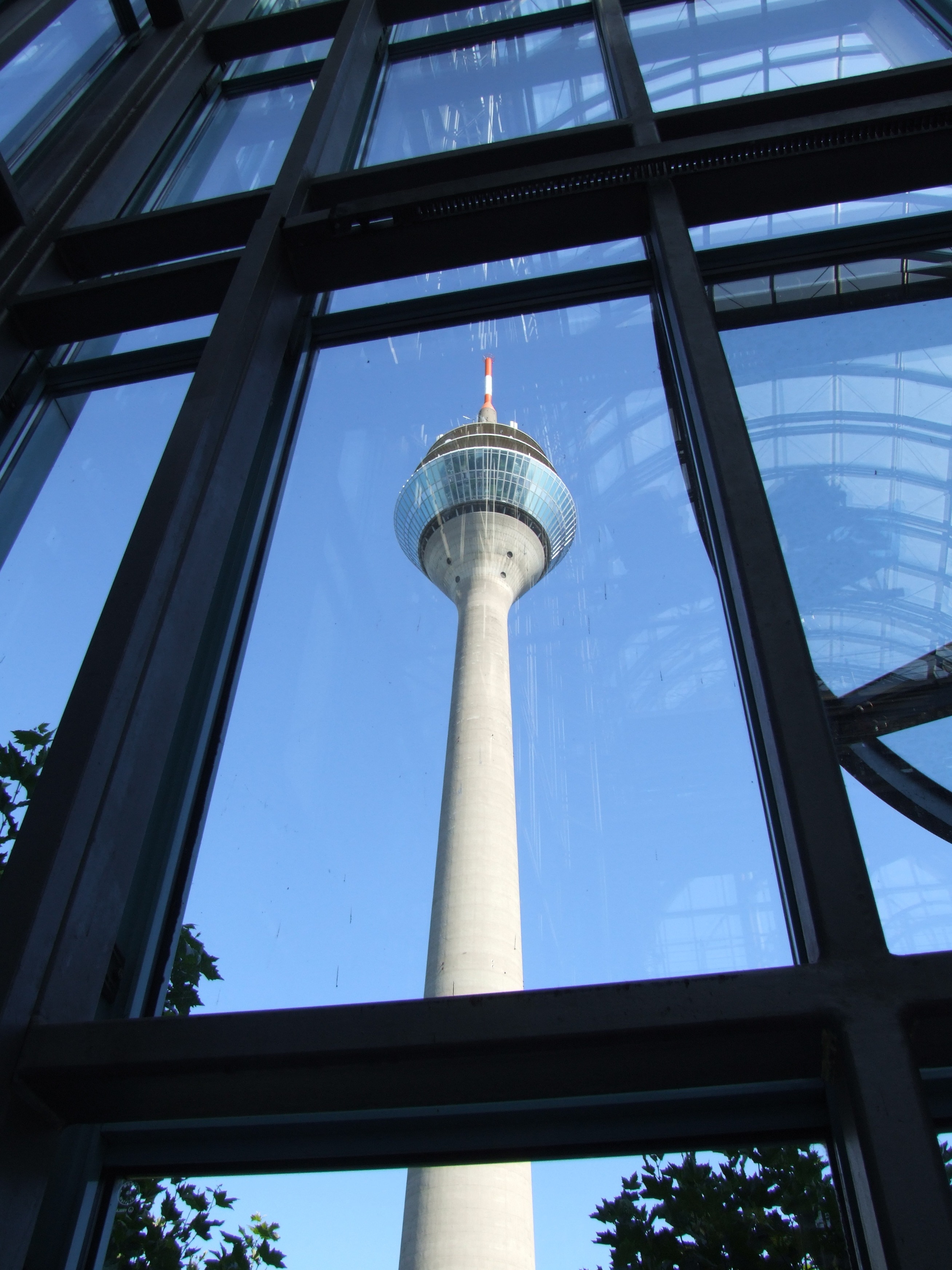 low angle view of tower and metal framed glass window