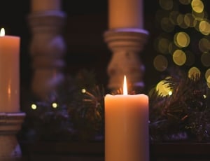 2 white pillar candles with lights thumbnail