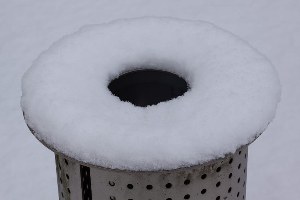 round tubular hole gray metal covered on snow preview