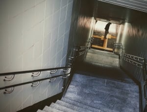 person standing near staircase thumbnail