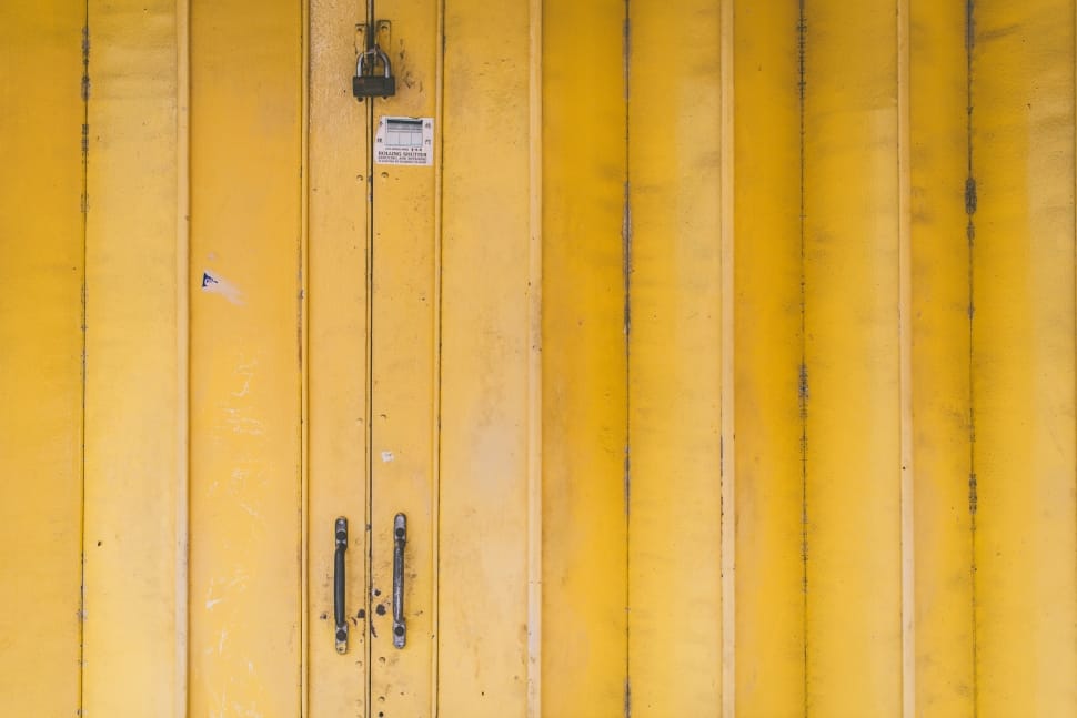 closeup view of yellow door with padlock preview