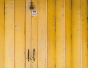 closeup view of yellow door with padlock thumbnail