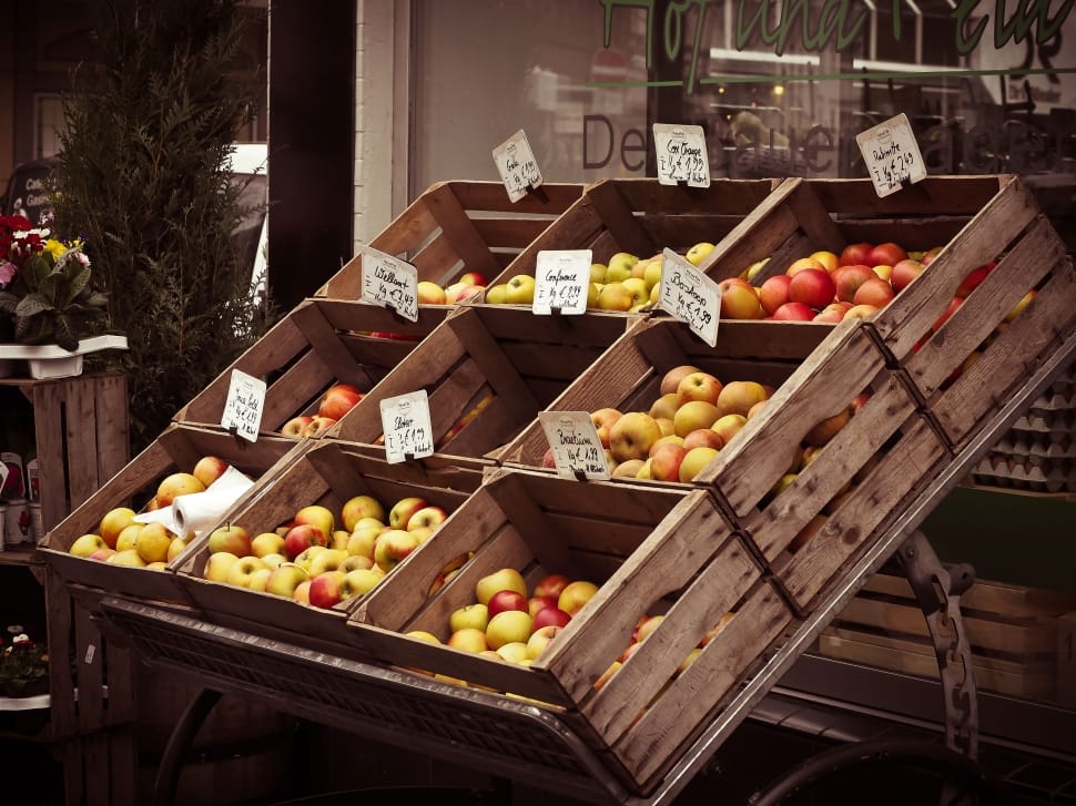 yellow and red fruits in brown wooden rack preview