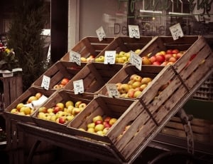 yellow and red fruits in brown wooden rack thumbnail