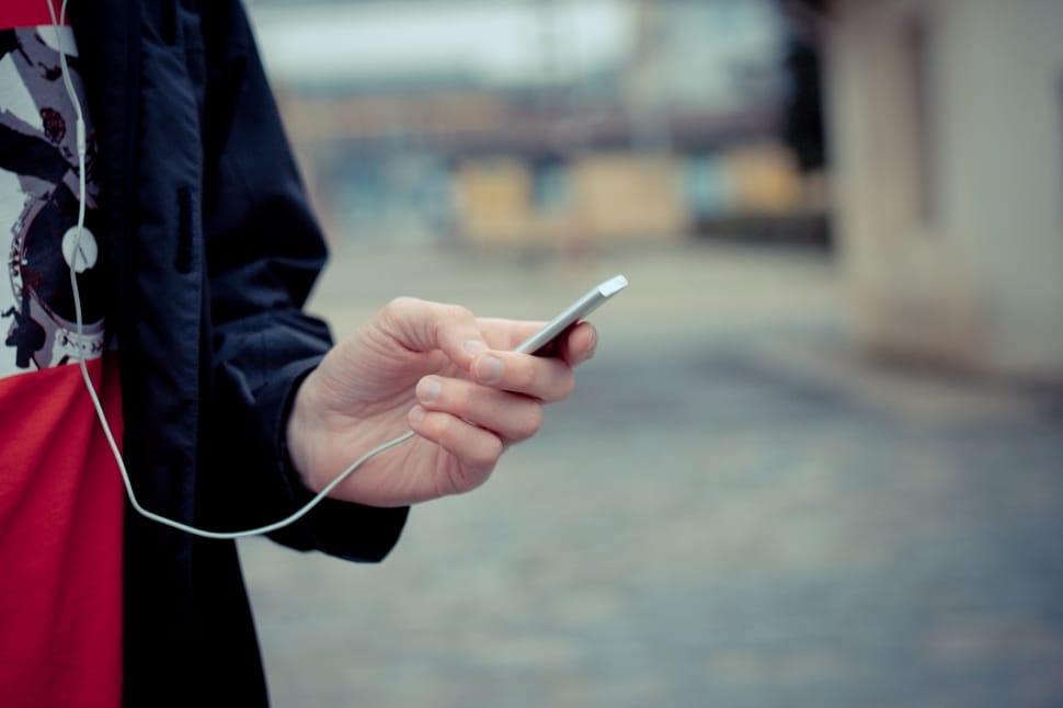 man holding white device preview