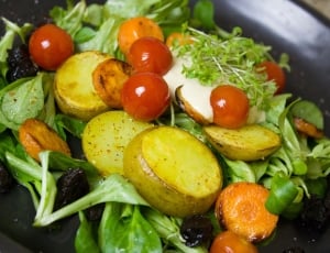 potatoes, carrots, tomatoes and green leaf vegetables thumbnail