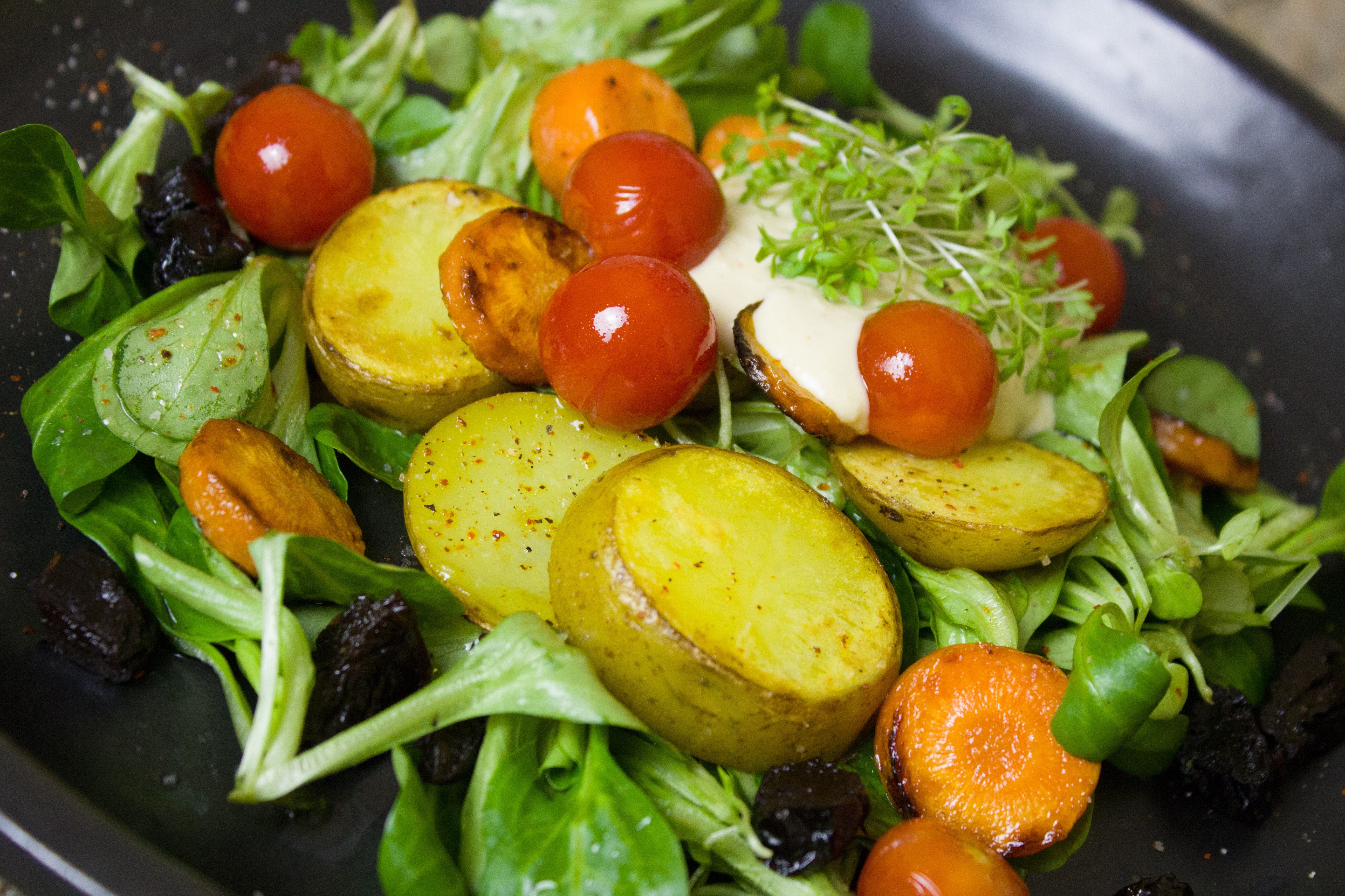potatoes, carrots, tomatoes and green leaf vegetables