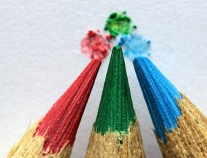 3 red, green, and blue, pencil color tips placed on white surface thumbnail