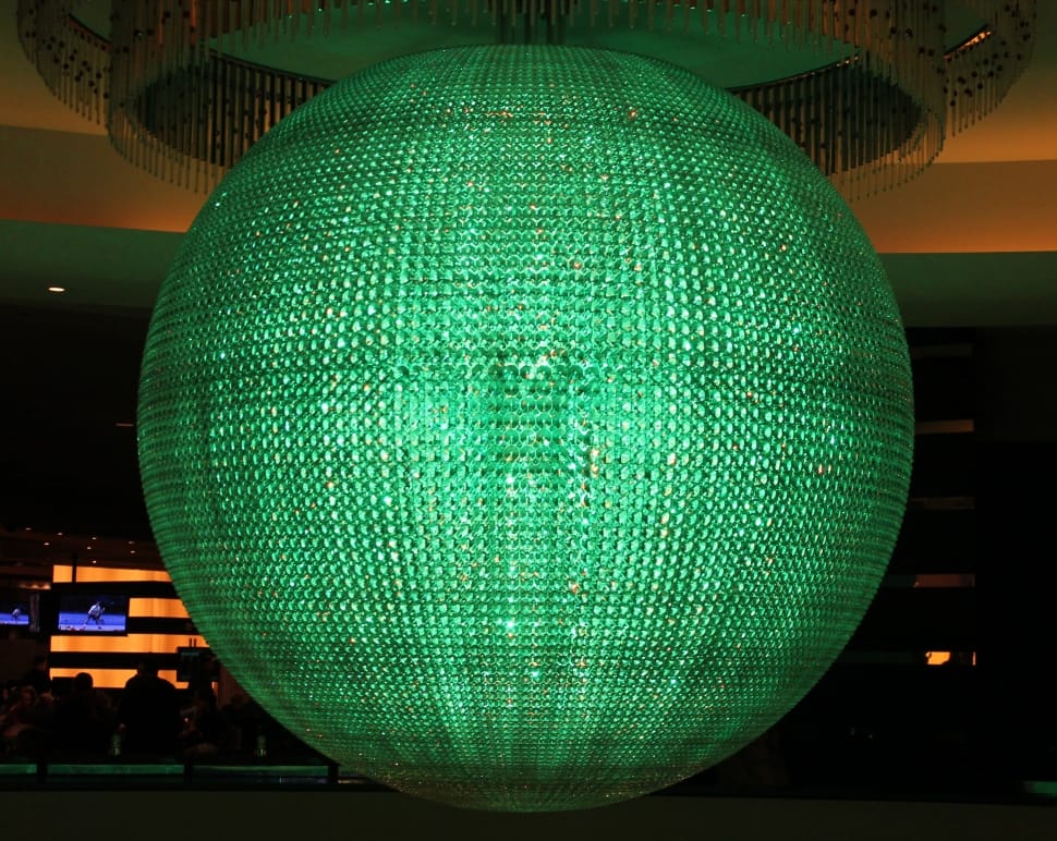 macro shot photography of round green chandelier preview
