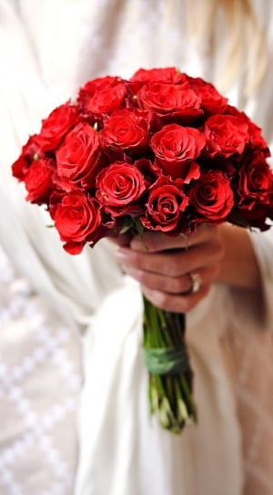 woman holding a red rose bouquet thumbnail