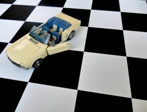 beige and blue car toy thumbnail
