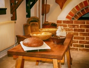 brown wooden table with 2 brown basket and bake bread lot thumbnail