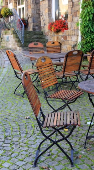 brown wooden rectangle outdoor table with eight chairs thumbnail