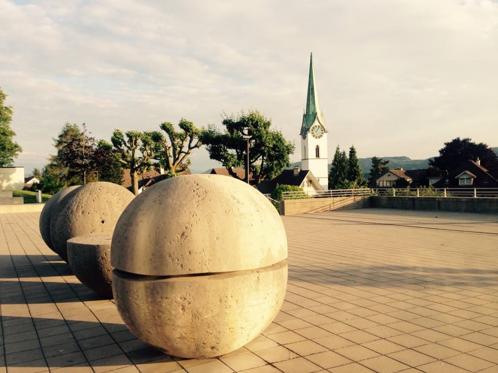 four beige concrete oval shape statues preview