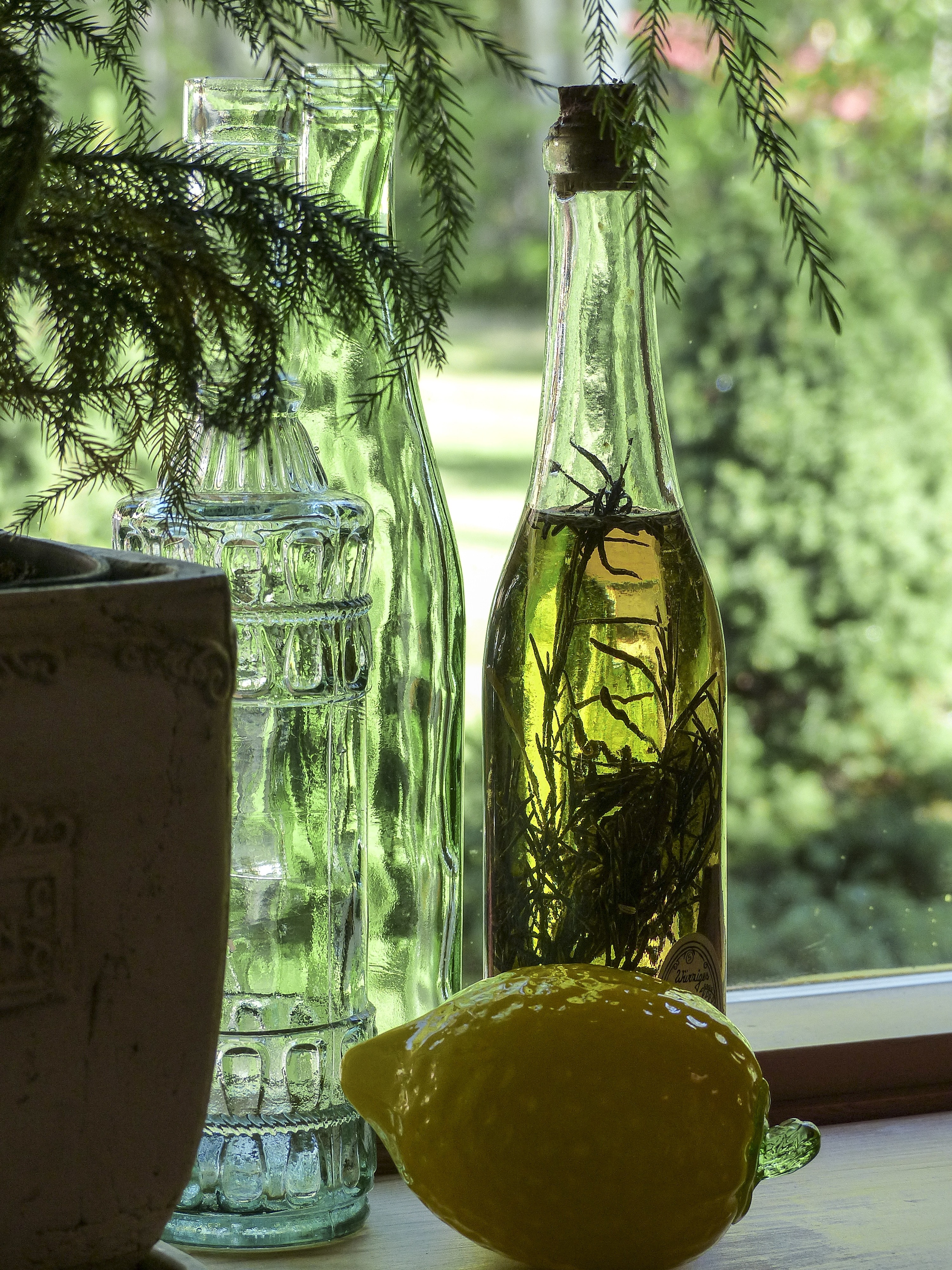 lemon ceramic fruit and 3 clear glass bottles