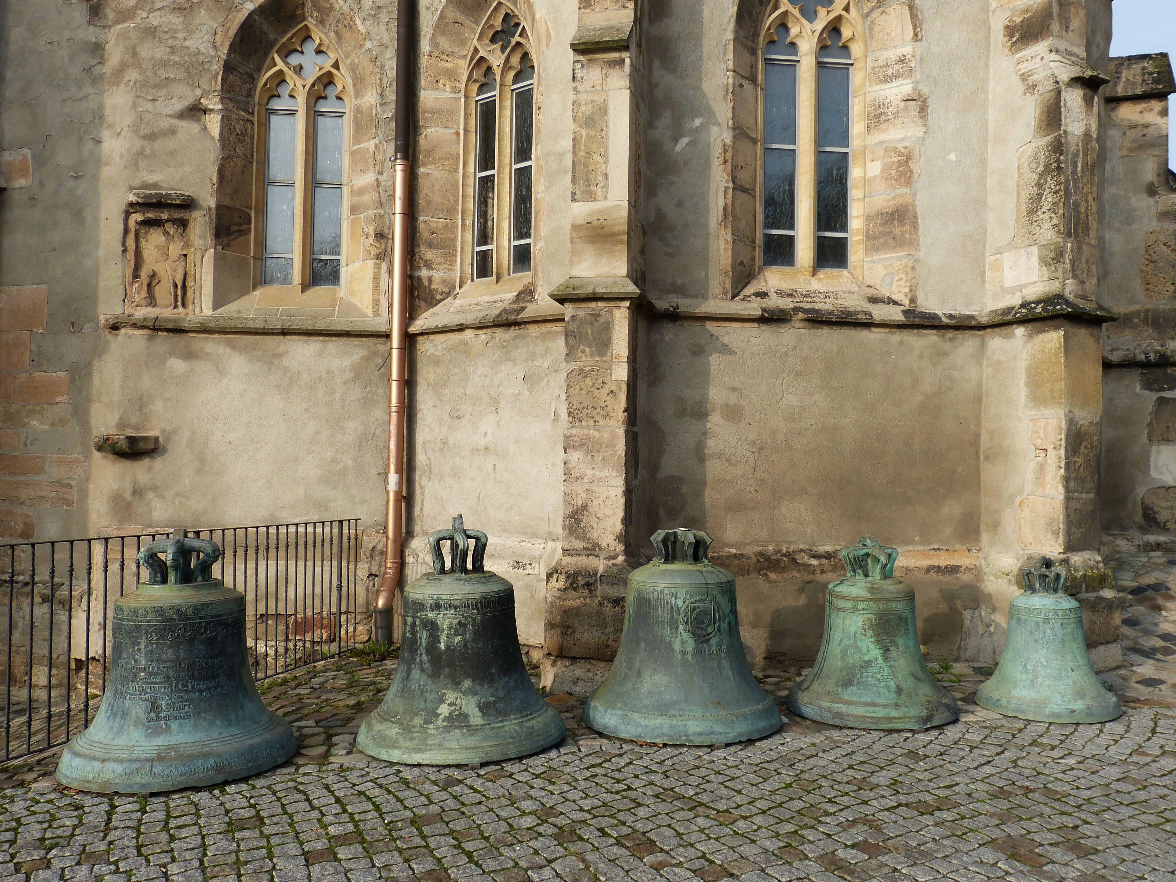 five church bells near in wall