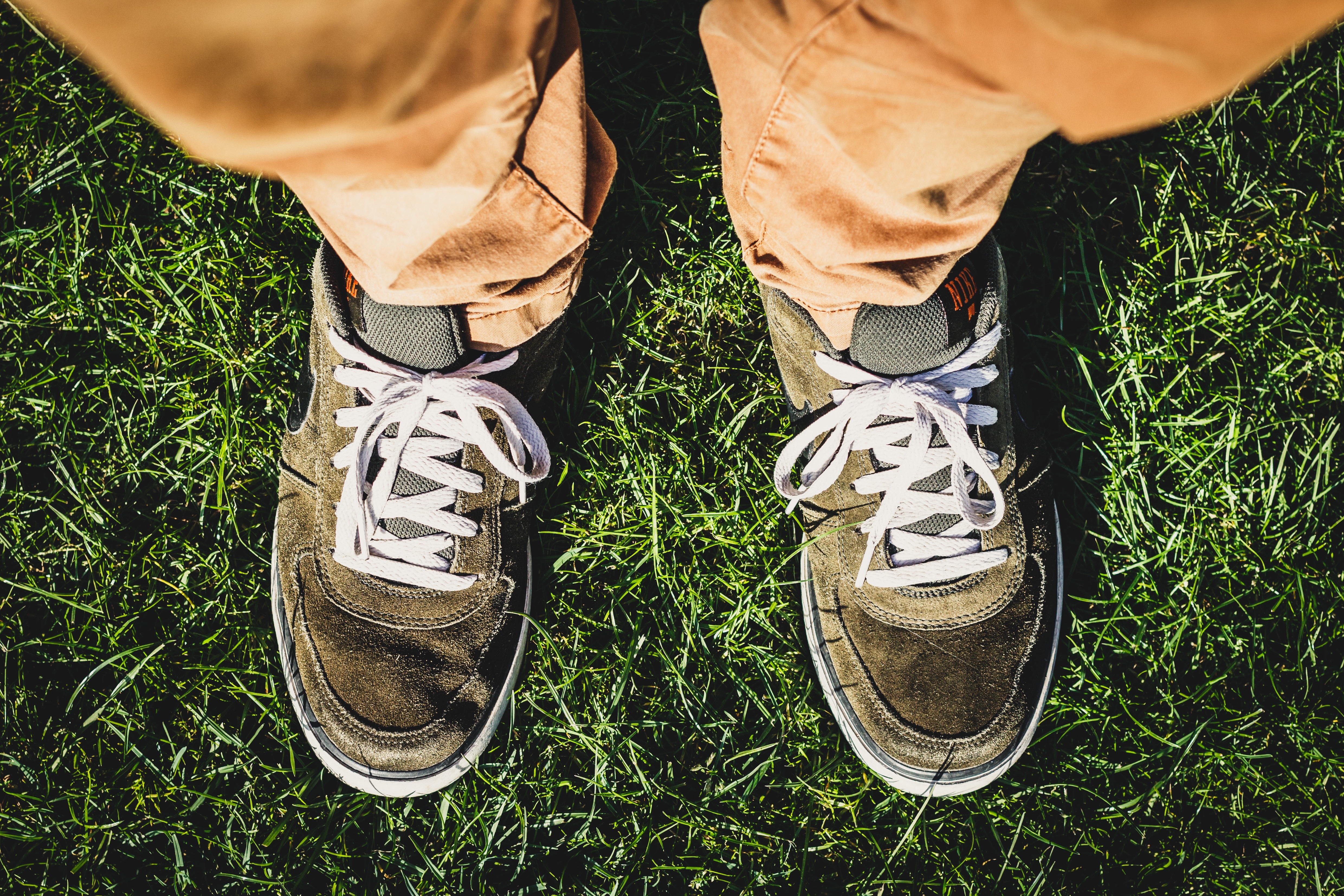 brown and gray suede low top sneakers