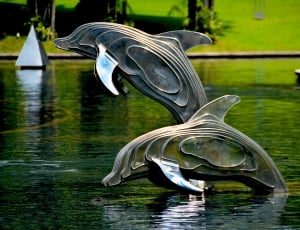 silver dolphin figurine thumbnail
