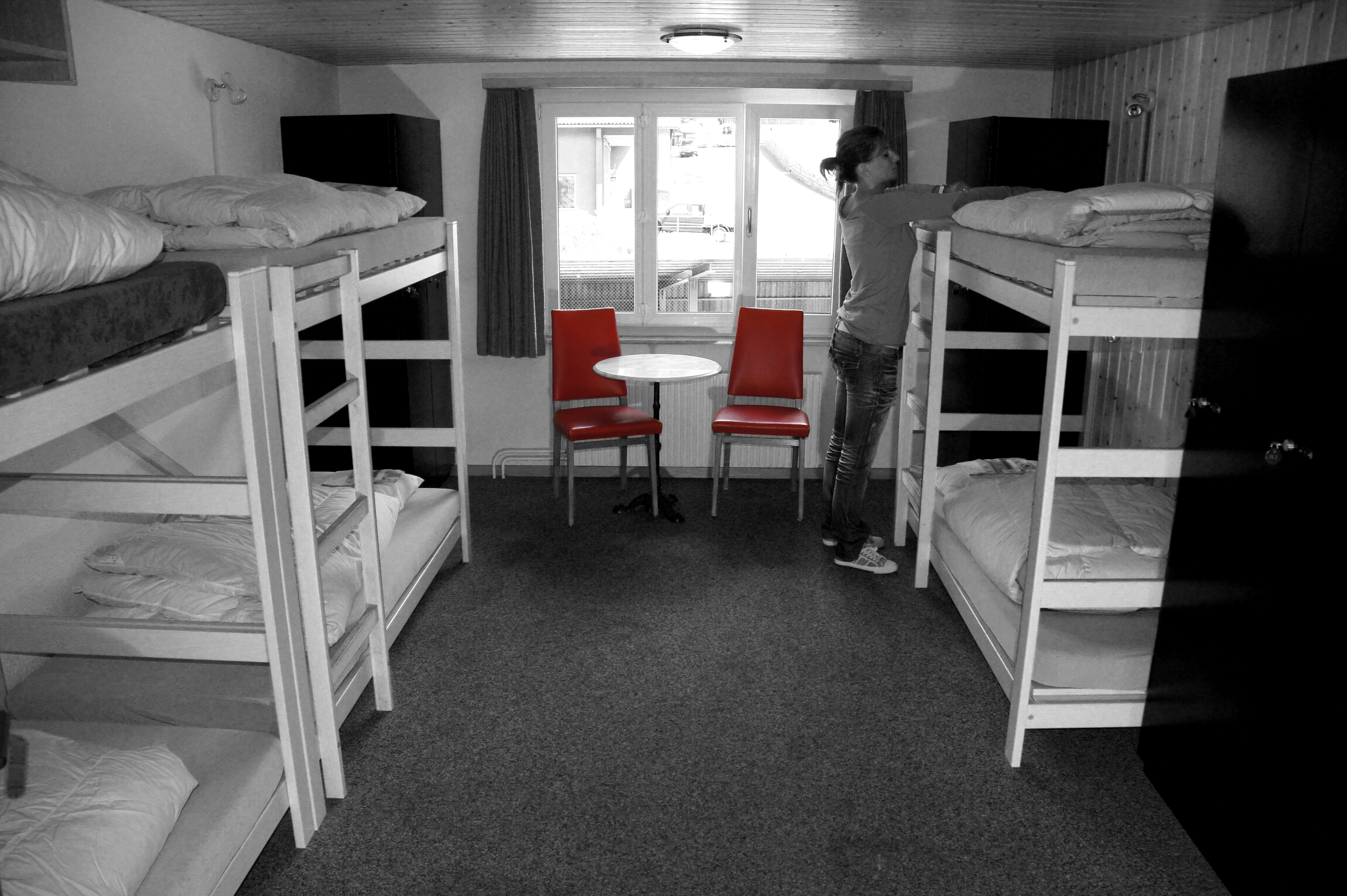 three wooden bunk beds