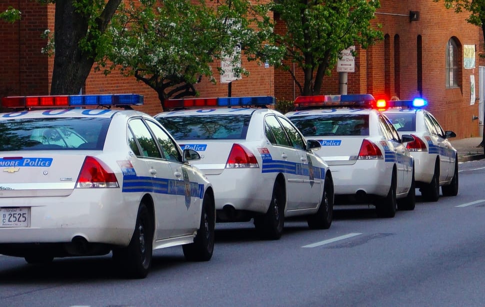 four white Police cars on same lane preview