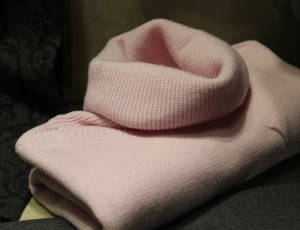 close up photo of pink knit turtle neck top thumbnail
