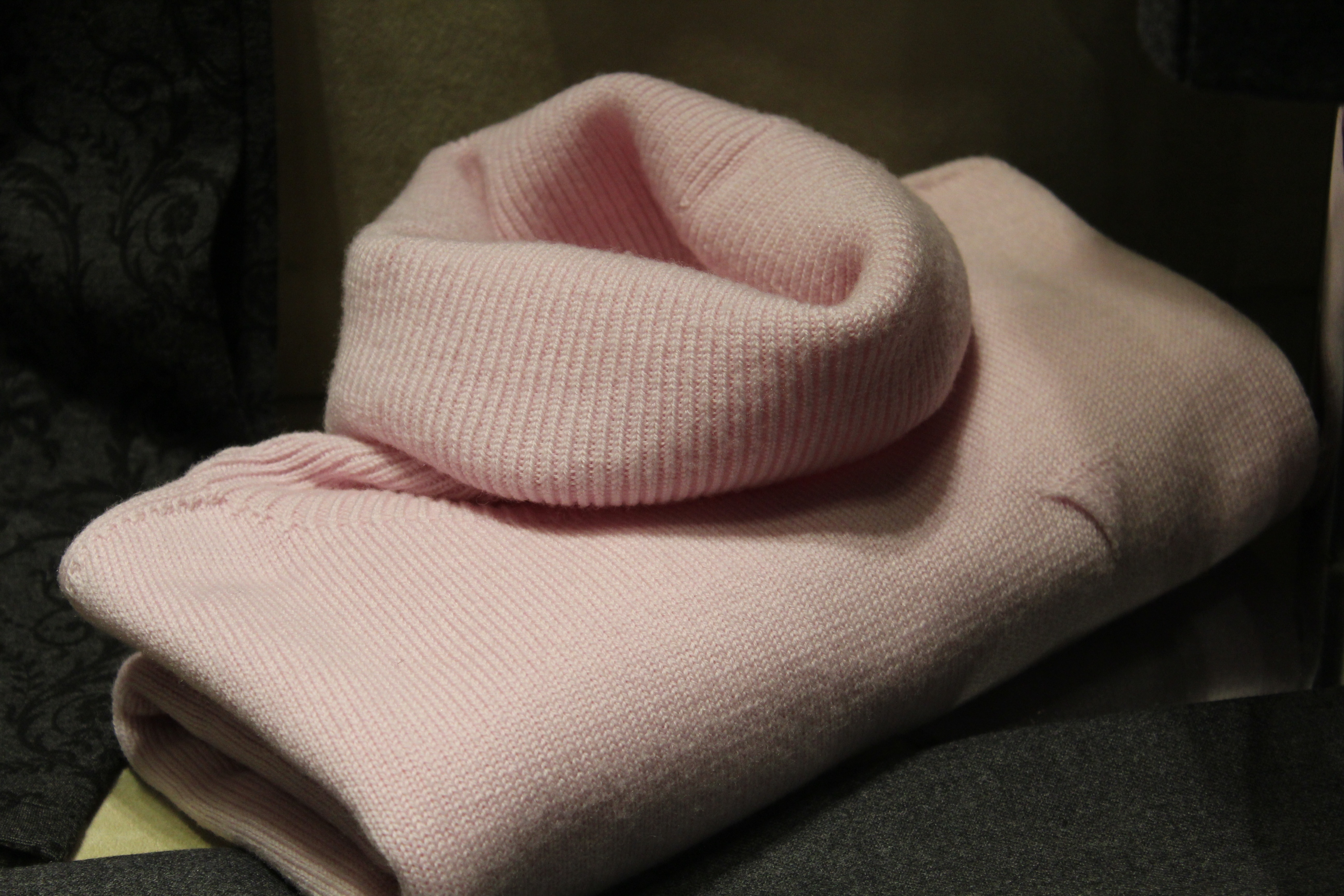 close up photo of pink knit turtle neck top