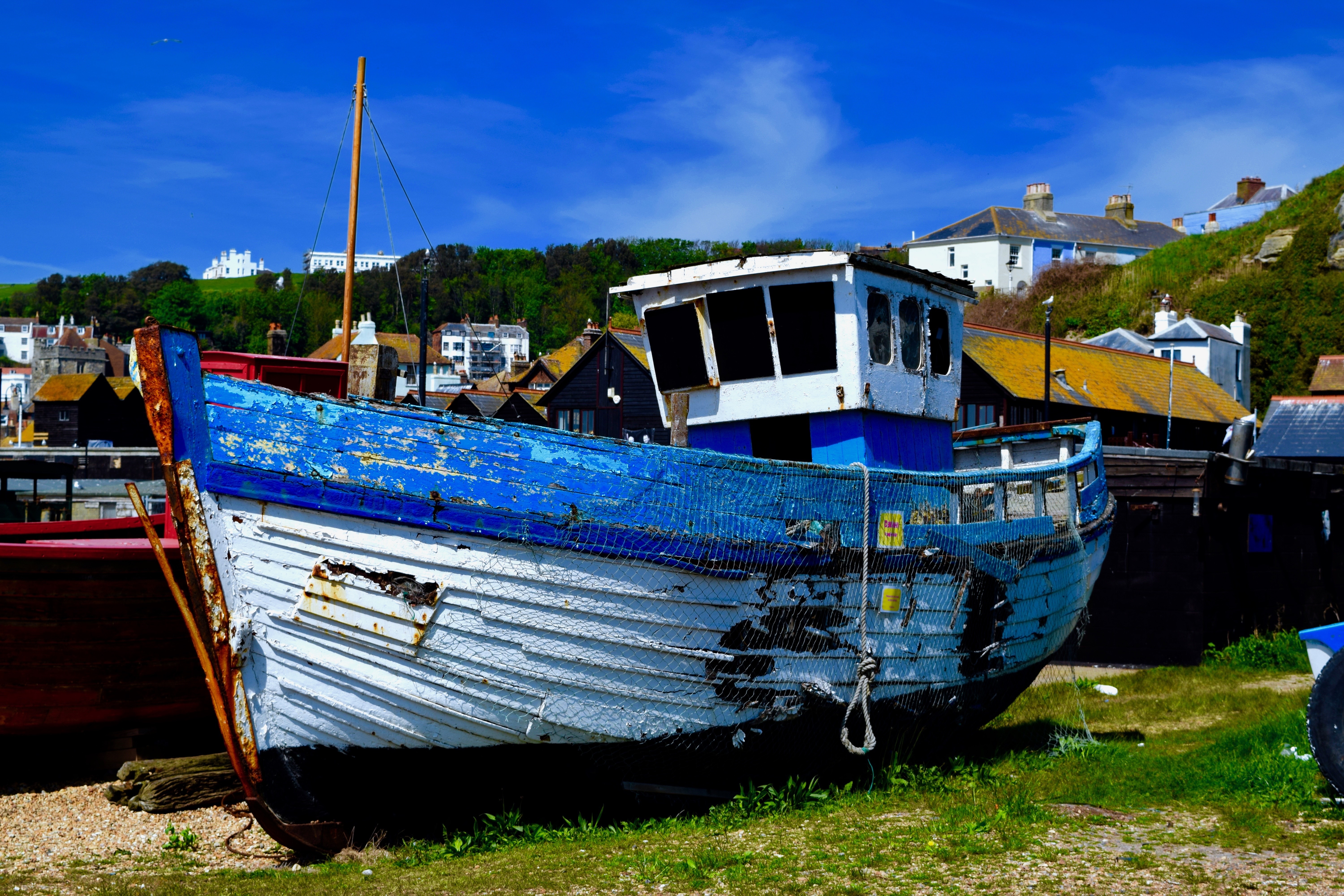 blue and white fishing boat