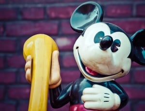 mickey mouse holding telephone figurine thumbnail