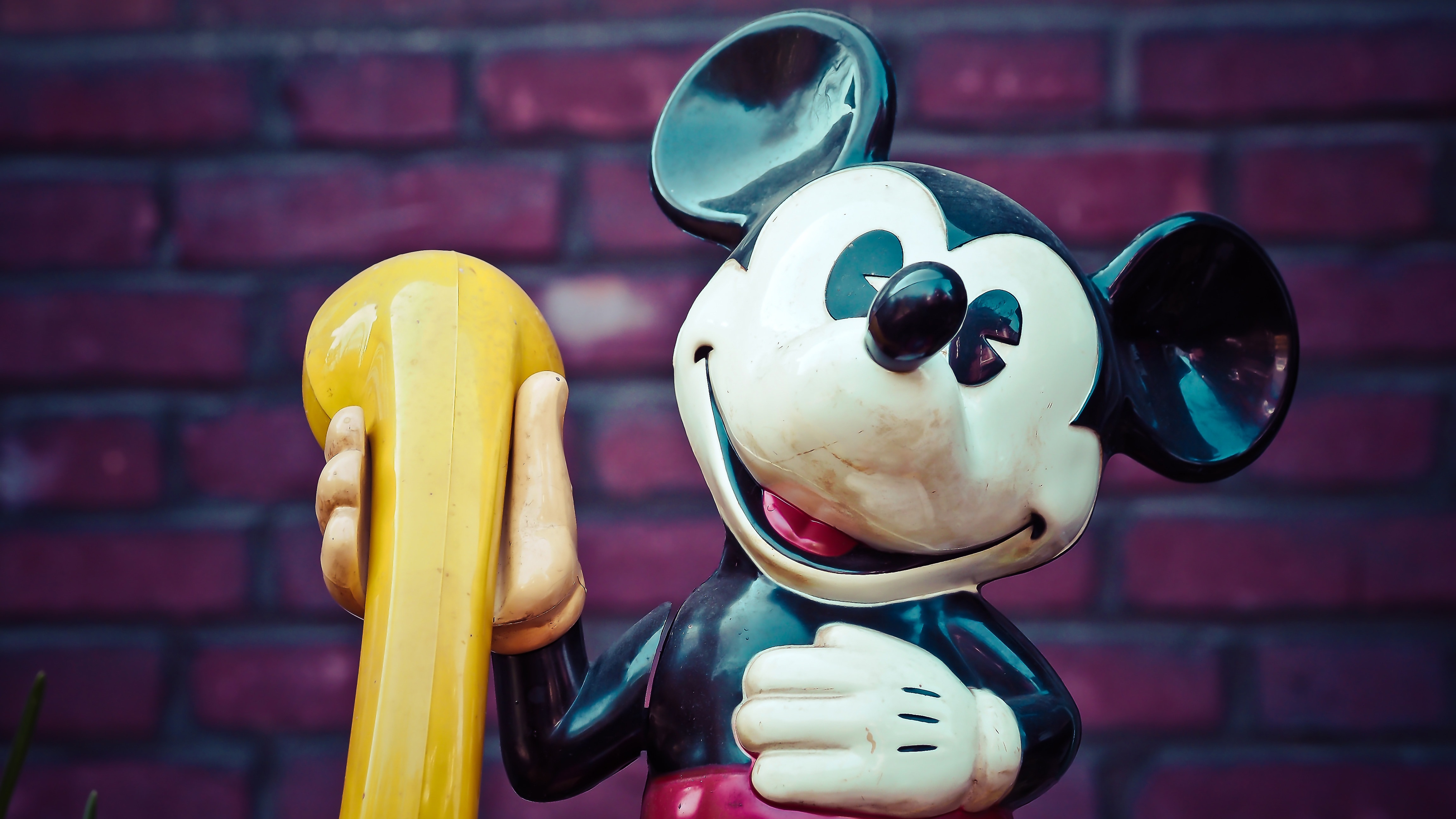mickey mouse holding telephone figurine