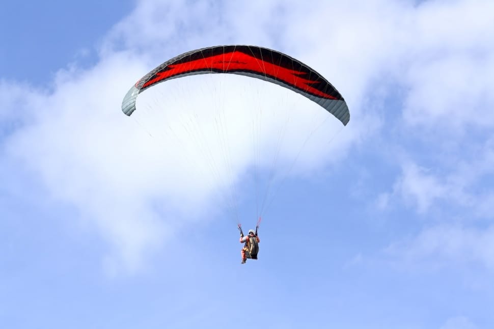 person paragliding during daytime preview