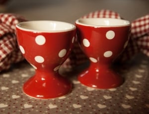 two red and white polka dot ceramic cup thumbnail