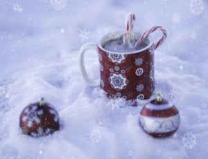 white and red ceramic mug and baubles thumbnail