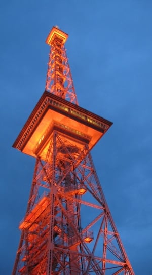 metal tower during dusk with orange lights thumbnail
