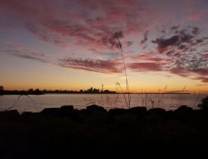 body of water during sunset photo thumbnail