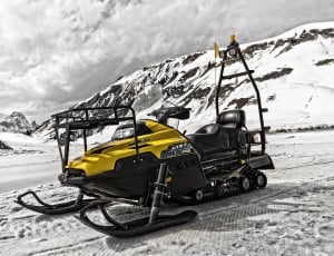 yellow and black snowmobile thumbnail