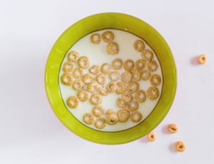 white and green ceramic bowl with cereals thumbnail
