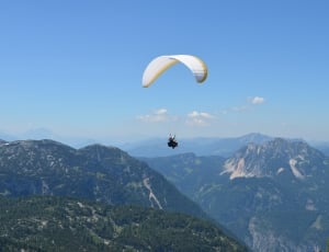paragliding man at daytime thumbnail