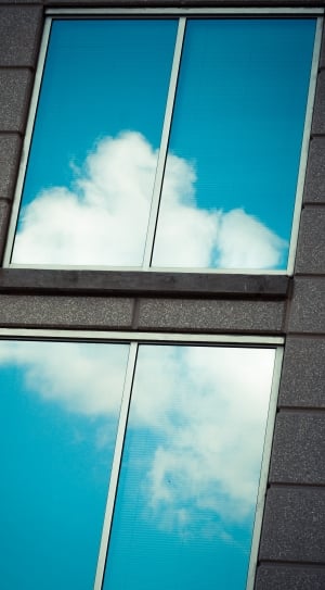 mirror image of blue cloudy sky during day time thumbnail
