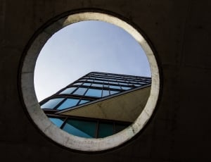 man hole view of building during daytime thumbnail