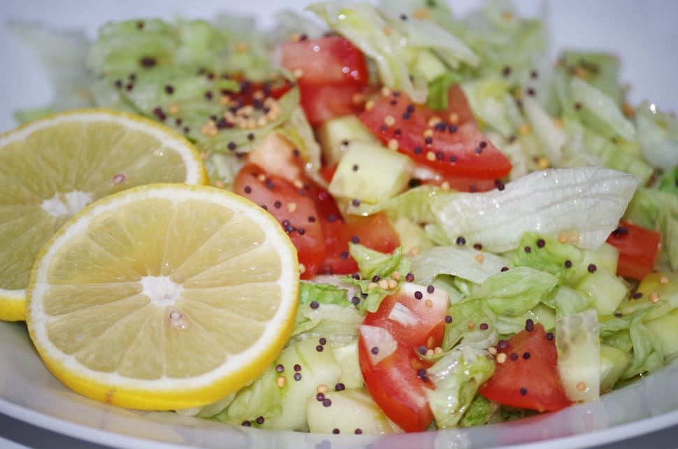 vegetable salad with two slice lemons preview
