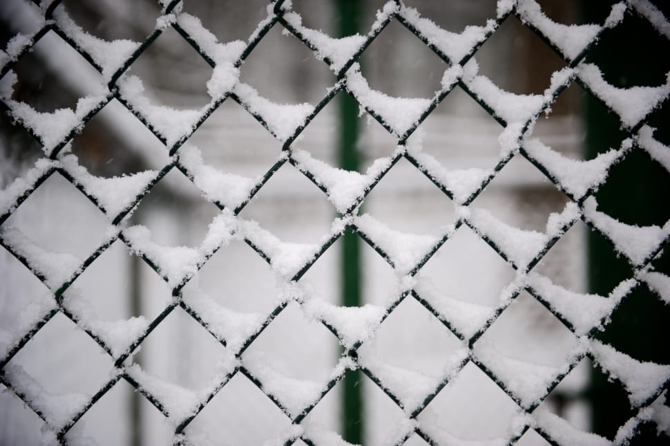 gray cyclone fence with snow preview