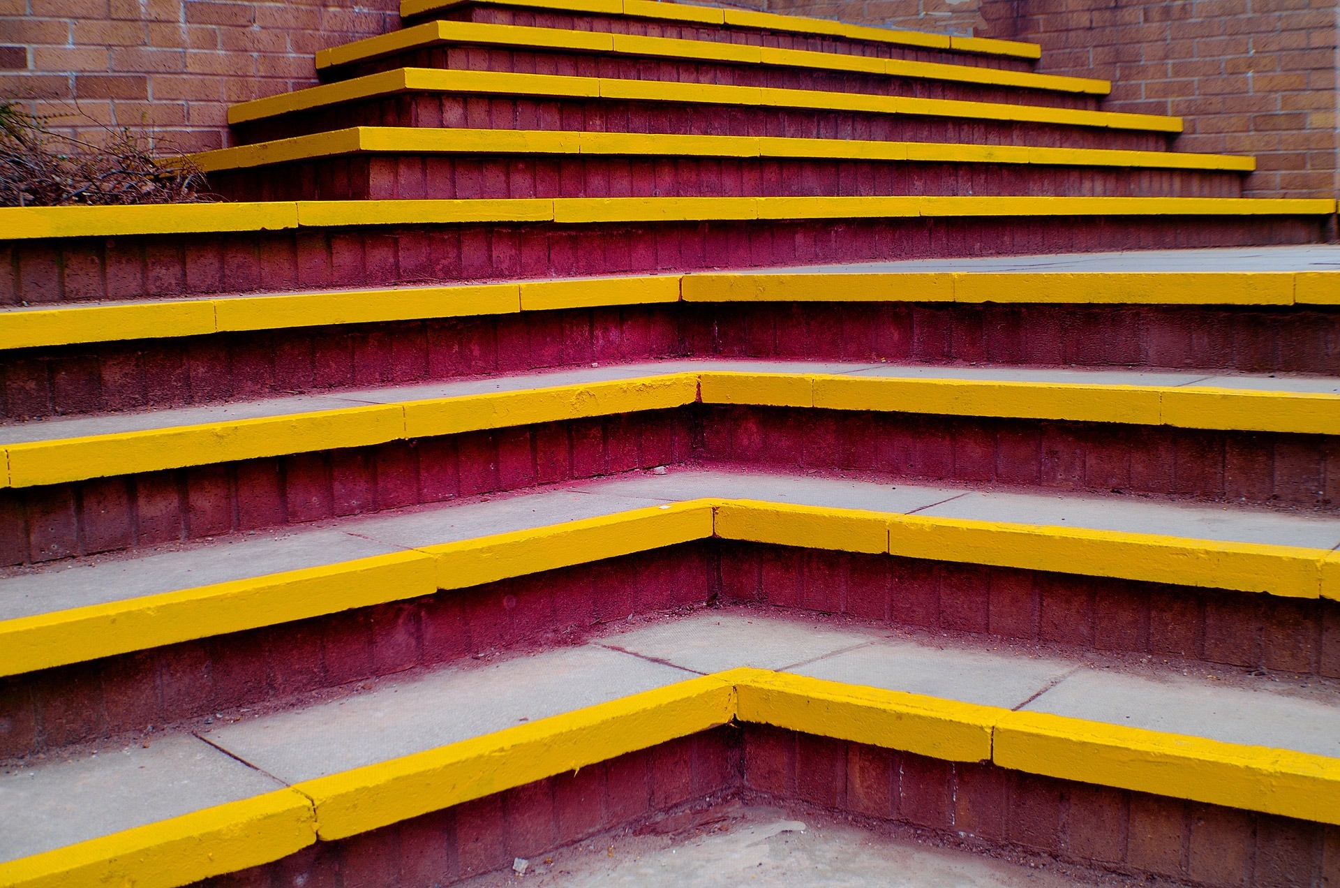 yellow and red painted concrete stairs