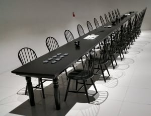 black wooden rectangular long table and chair set thumbnail