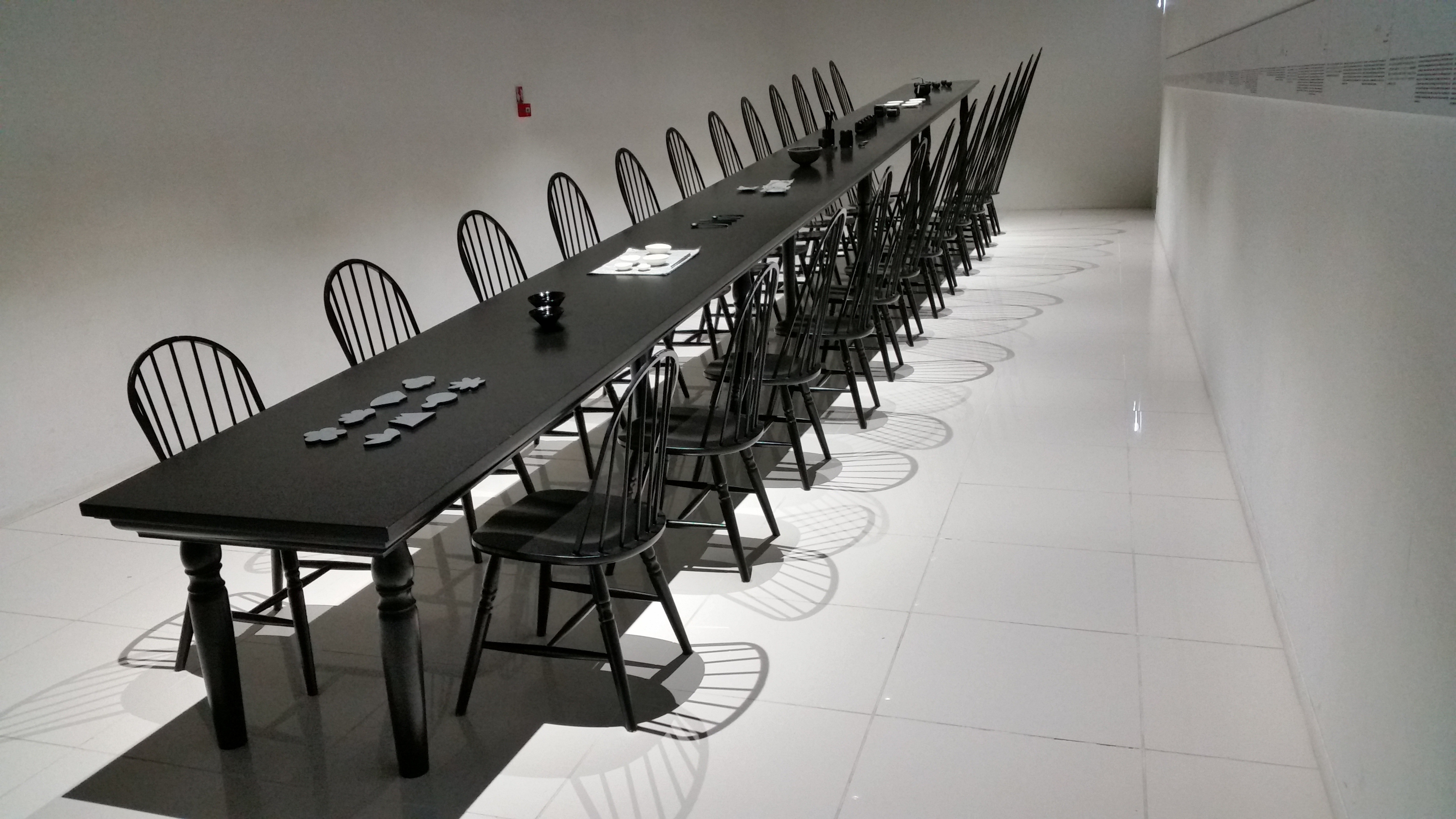 black wooden rectangular long table and chair set