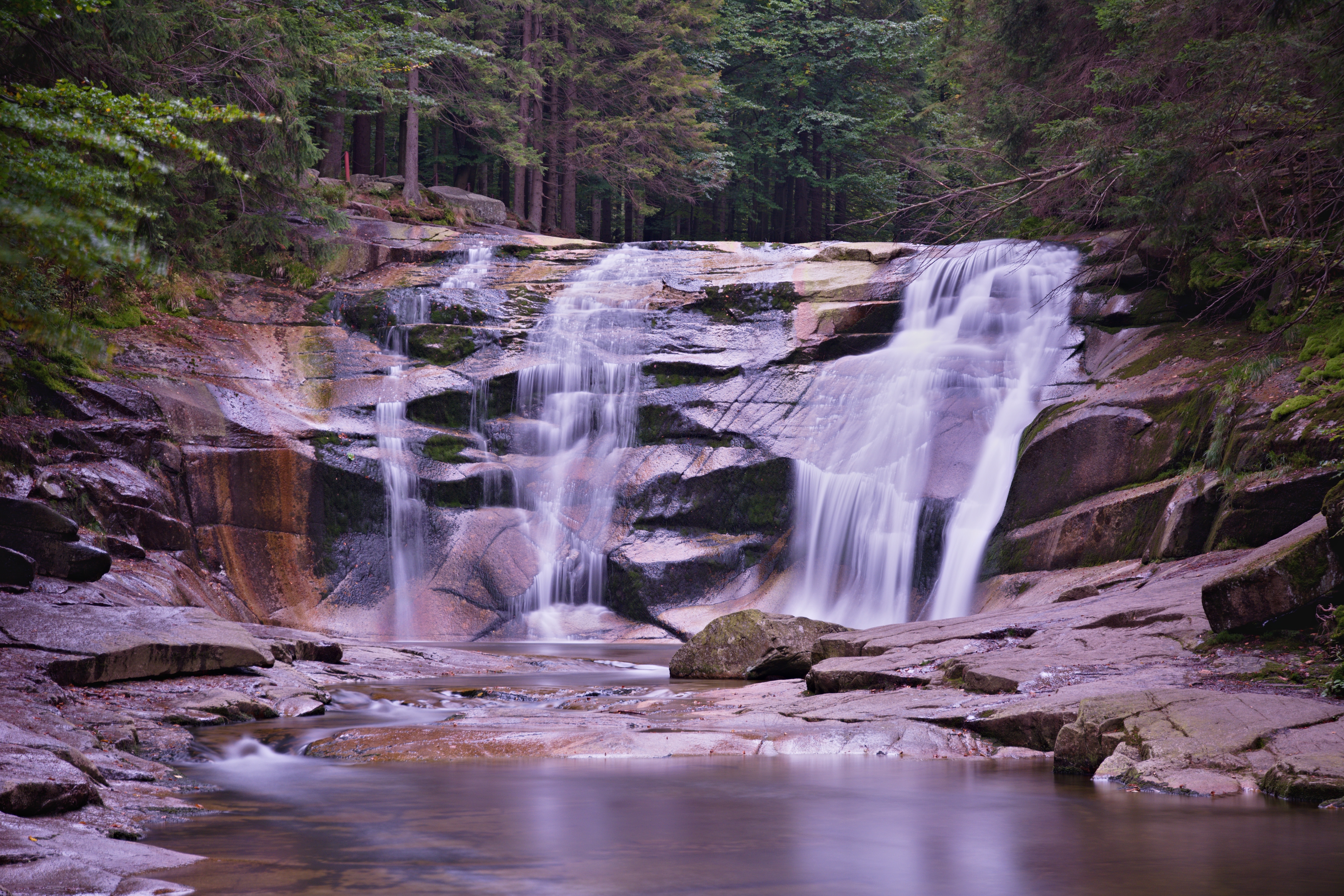 waterfalls on brown rocks