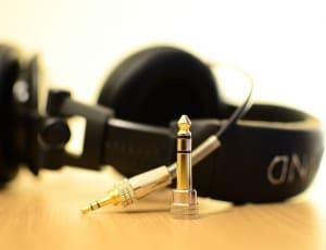 black corded headset and audio jack thumbnail