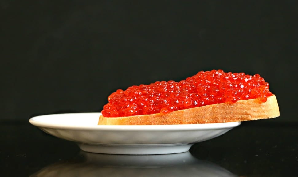 loaf of bread with fruit jam served on a white platter preview