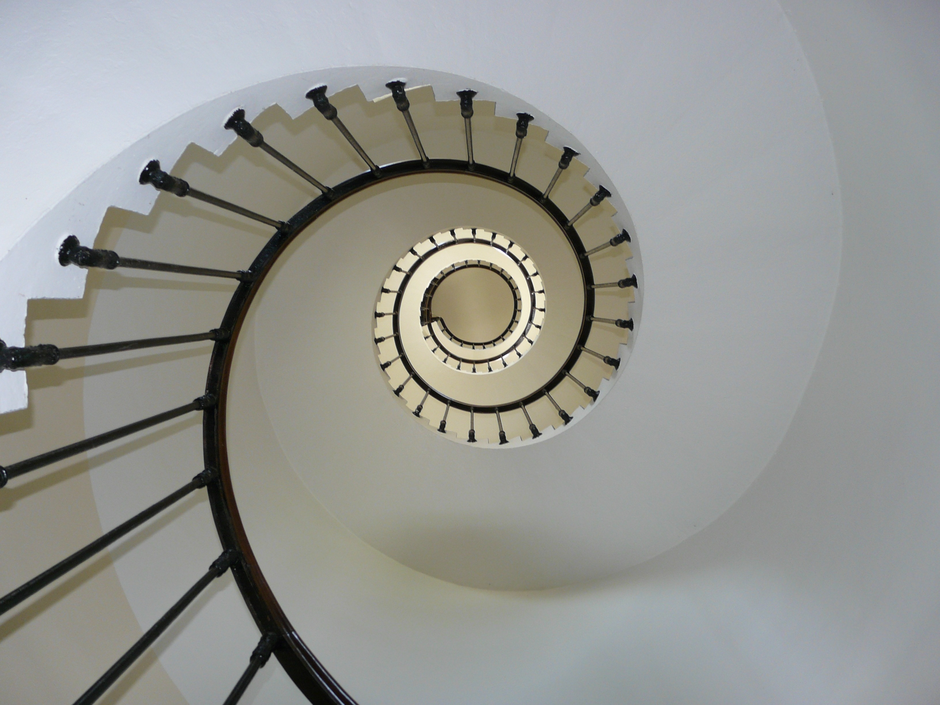 black handrails spiral stairs