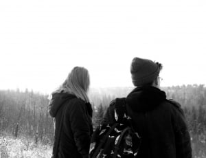 grayscale photo of man and woman standing thumbnail