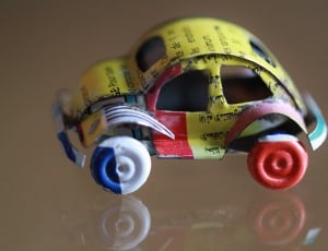 yellow, red and blue beetle toy car thumbnail